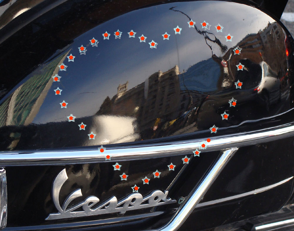 La ciudad en el lóbulo de una Vespa
